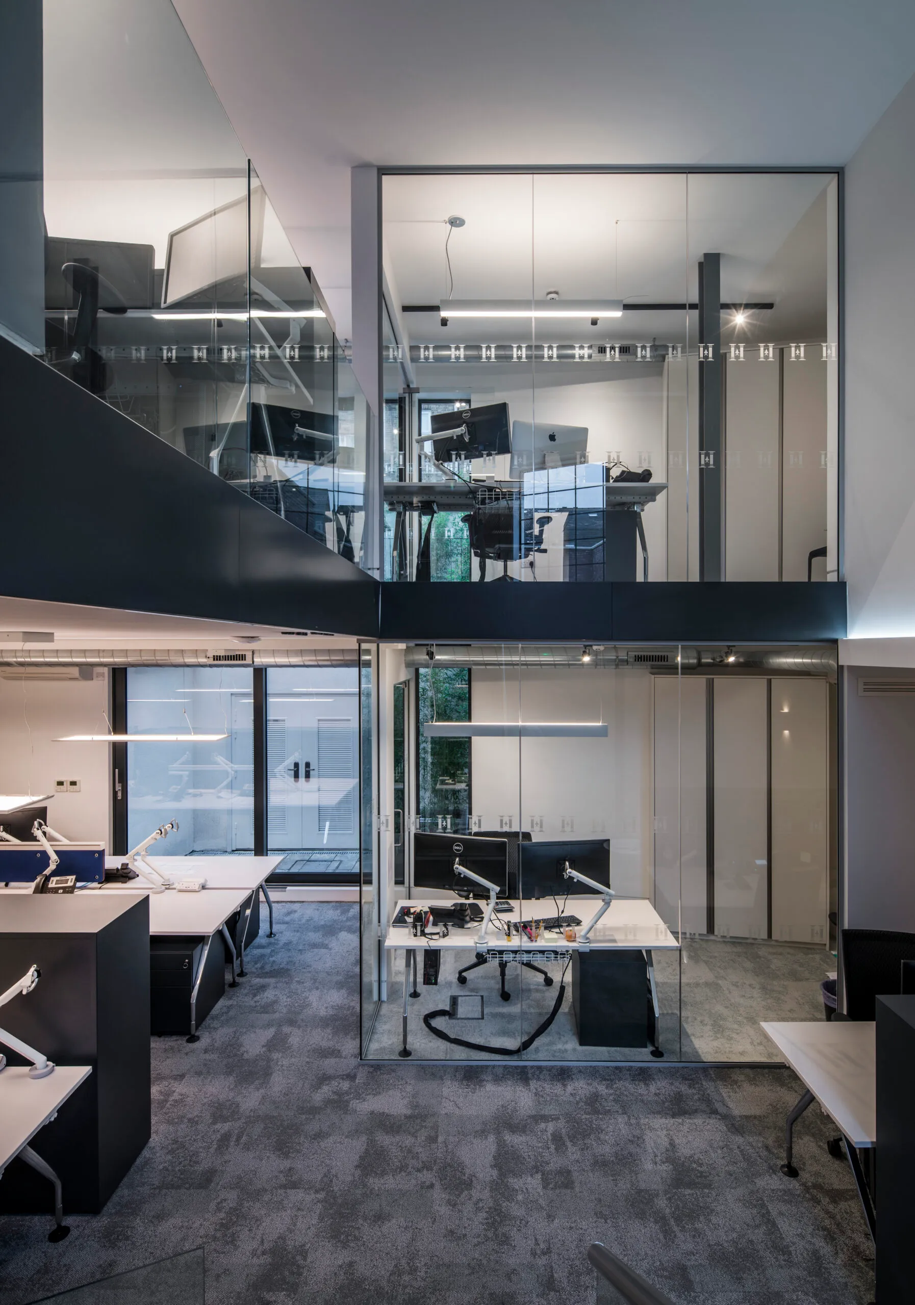 Photo of charterhouse heritage office space with warm contemporary lighting and modern interior design
