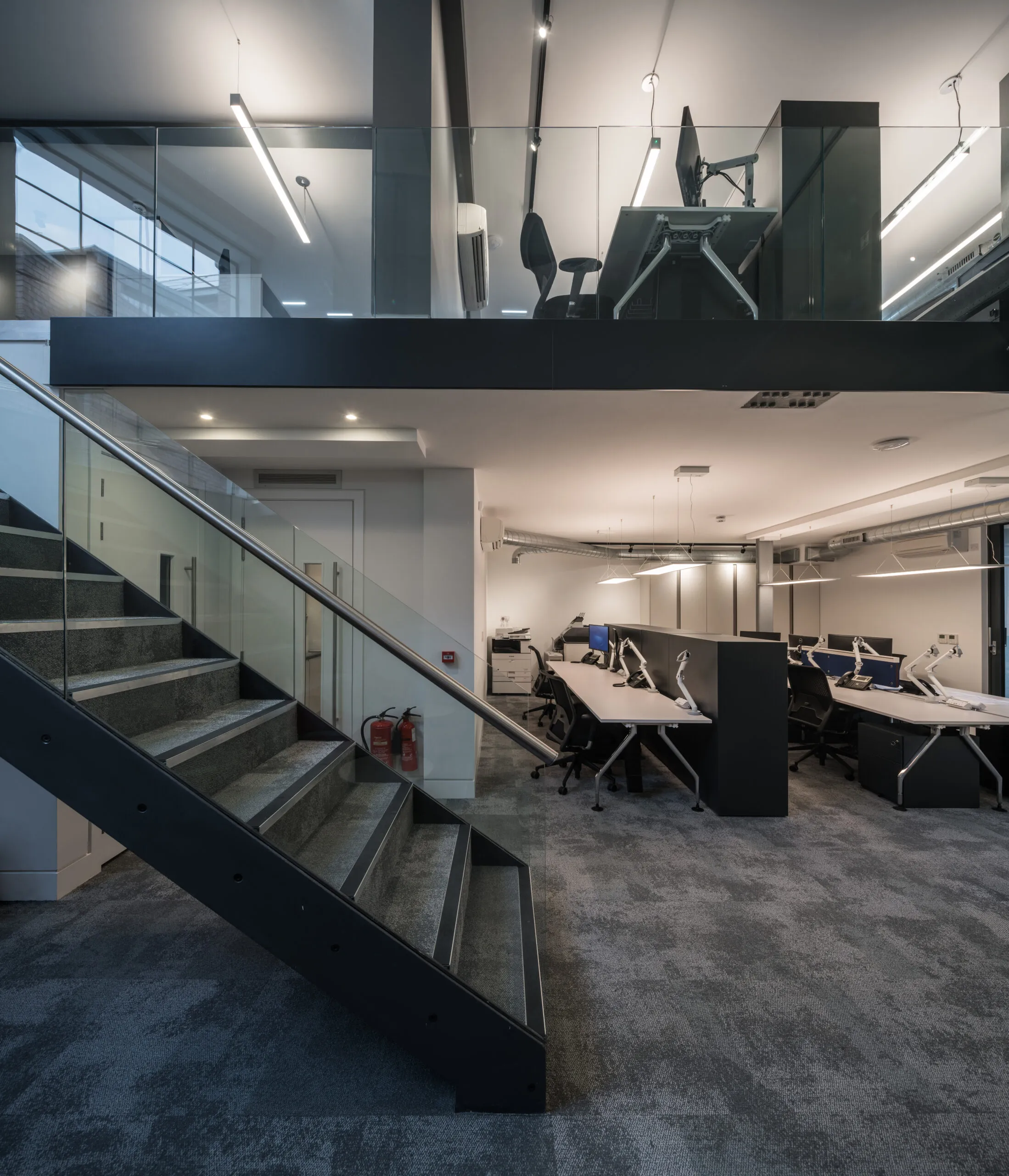 Photo of charterhouse historic building staircase with modern workspace lighting and contemporary design