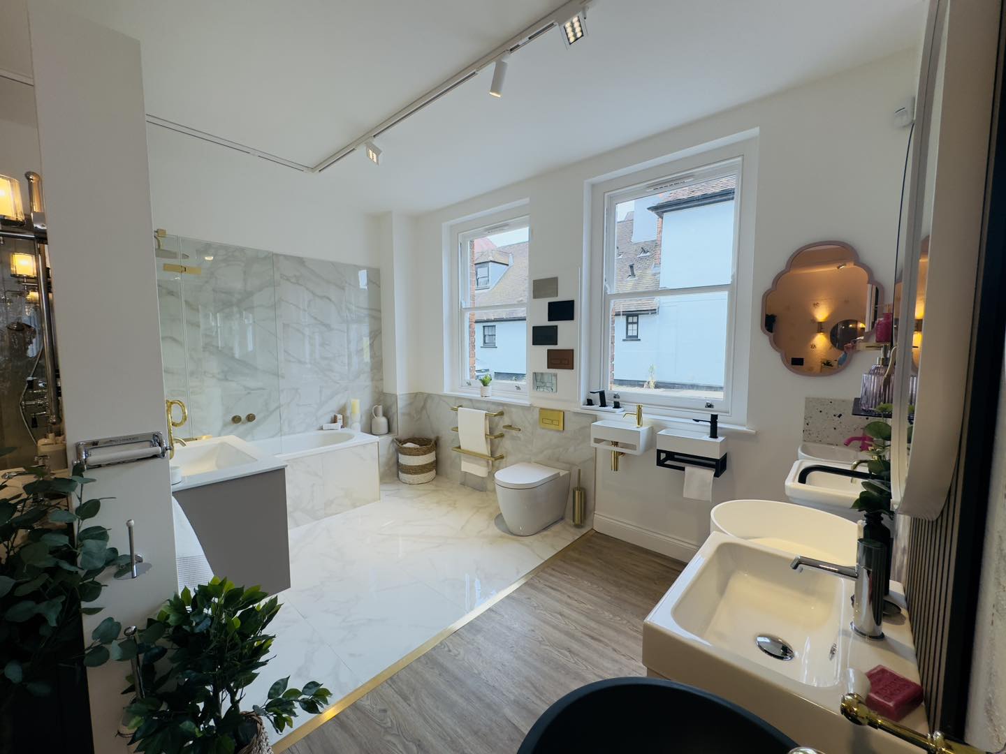 Photo of edwins plumbing showroom bathroom display with warm ambient lighting