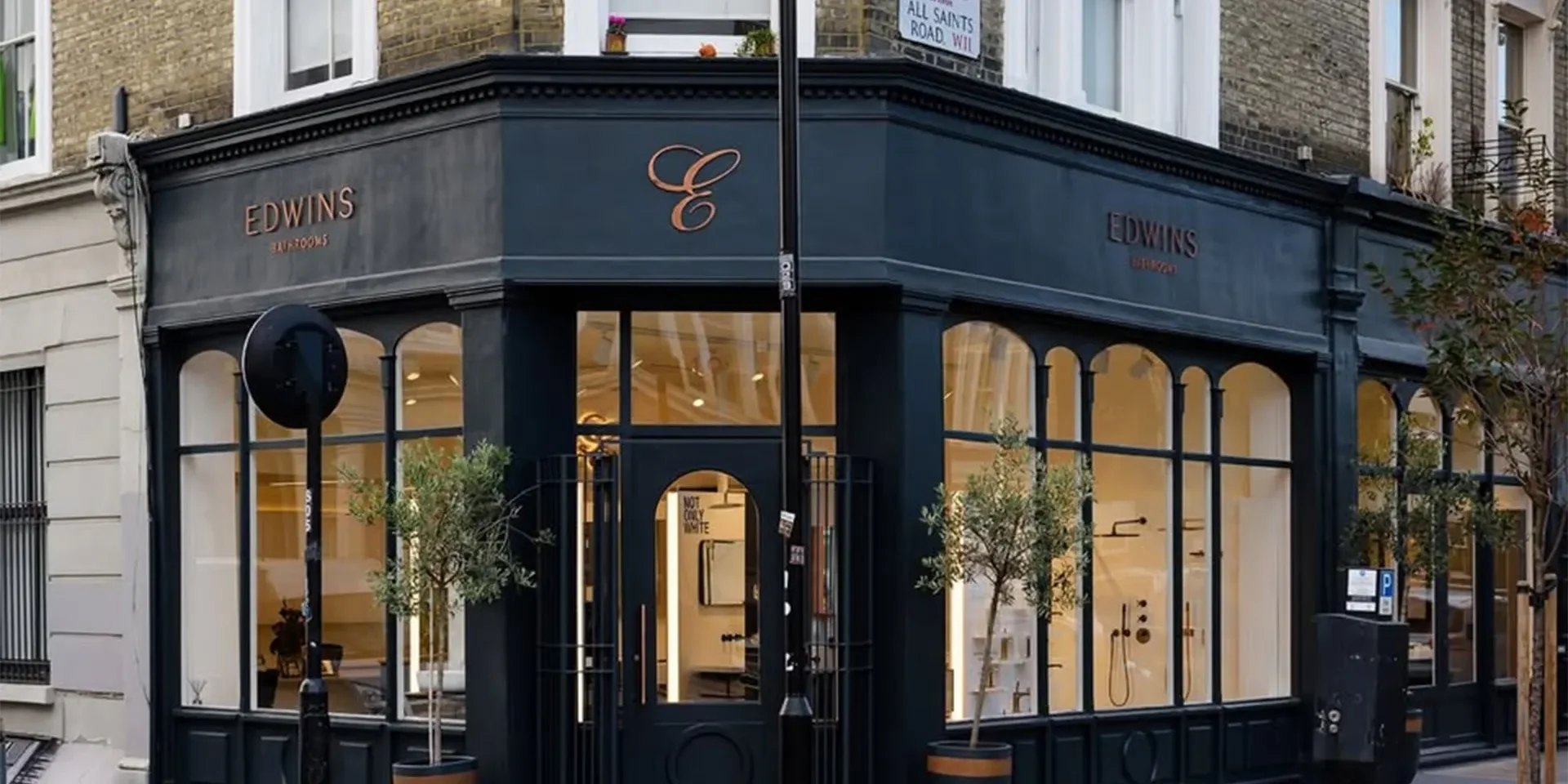 Photo of edwins retail storefront with contemporary window display and modern lighting design