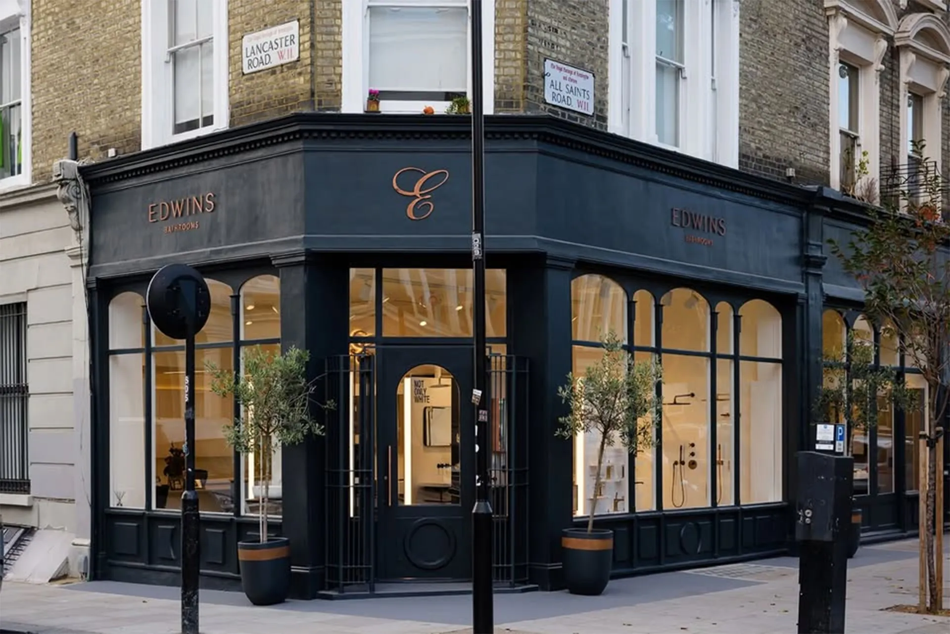 Photo of edwins retail storefront with contemporary window display and modern lighting design