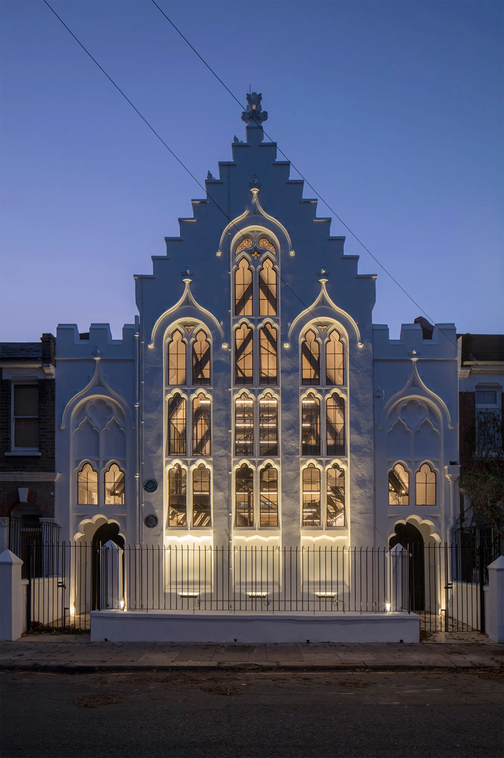 Photo of iffley road historic church conversion with warm golden ambient lighting and heritage architecture