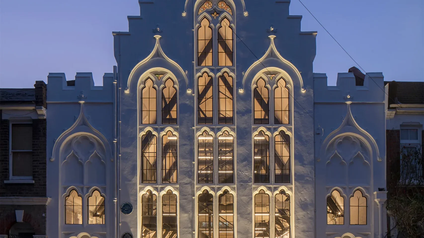 Photo of iffley road historic church conversion with warm golden ambient lighting and heritage architecture