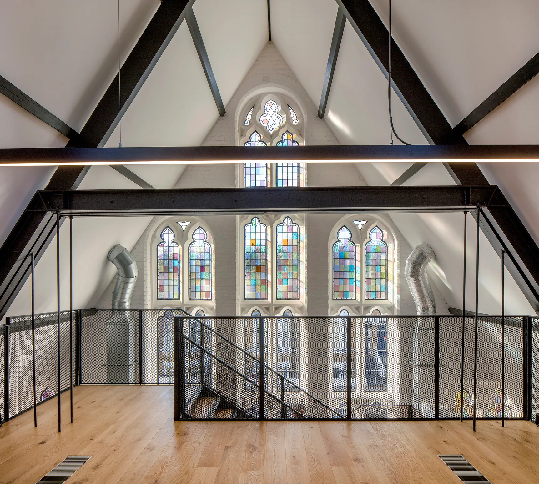 Photo of iffley road historic listed building office space with white columns and modern minimalist lighting