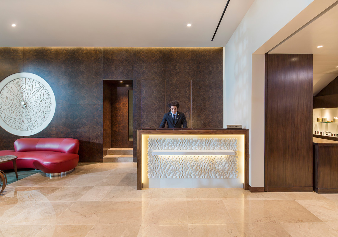 Photo of metropolitan hotel lobby with contemporary accent features and modern lighting design