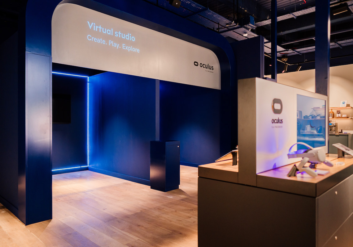 Photo of situ live commercial retail space with blue architectural lighting and contemporary exhibition design