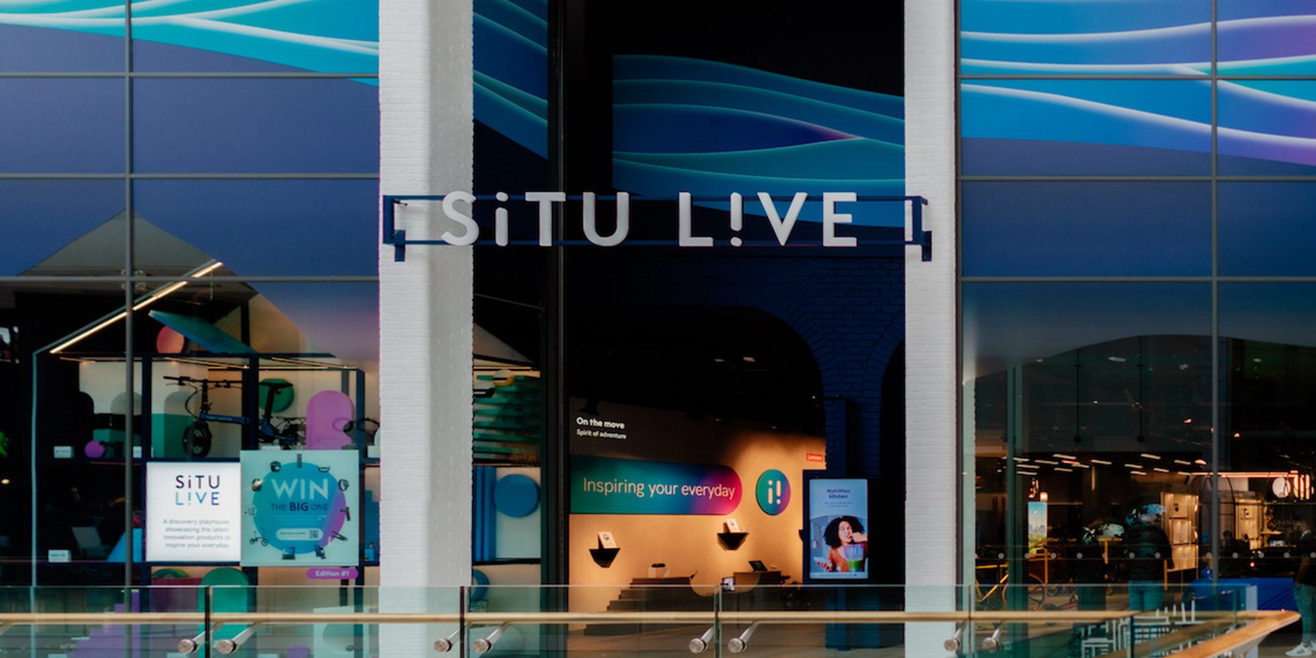 Photo of situ live retail storefront window display with blue contemporary lighting and modern showcase design