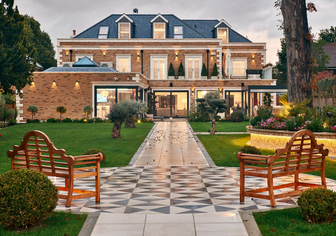 Photo of elm grove residential garden with contemporary pathway lighting and landscaped evening ambiance