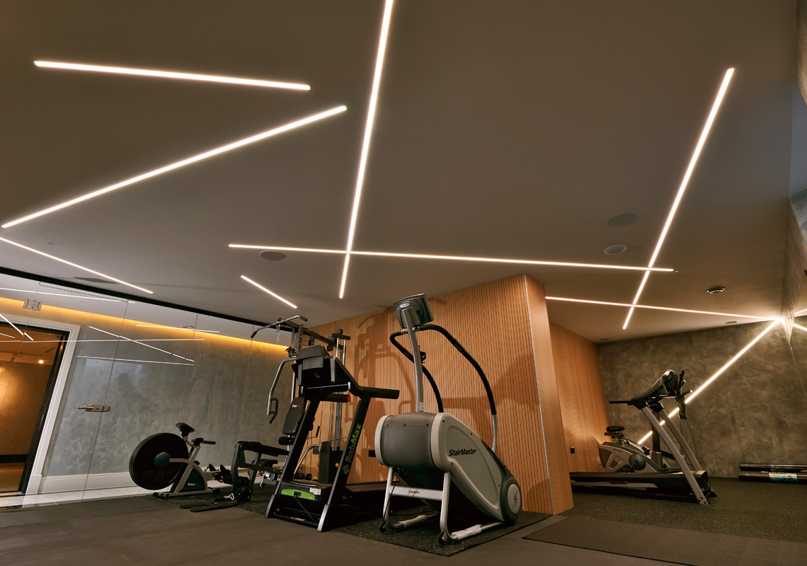 Photo of elm grove home gym space with modern functional lighting and minimalist contemporary design