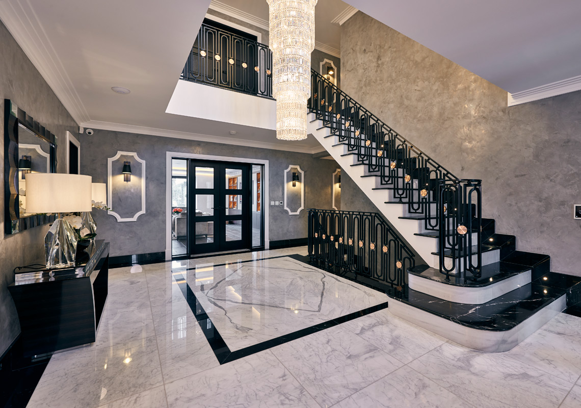 Photo of elm grove residential lobby with contemporary staircase and modern architectural lighting design